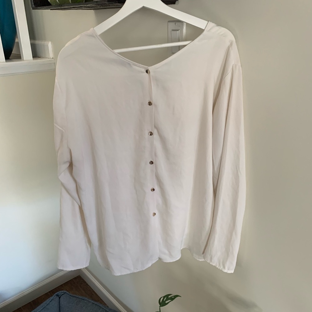 Simple white long sleeve with statement back